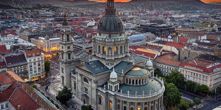St Stephen’s Basilica in Budapest under an orange sunset